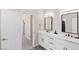Elegant bathroom with dual vanities, quartz countertops, and modern fixtures, offering a clean and bright aesthetic at 191 Reed Ln, Henderson, NV 89074
