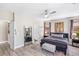 Spacious bedroom with stylish decor, lots of natural light, and a sleek full-length mirror at 191 Reed Ln, Henderson, NV 89074