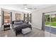 Comfortable bedroom featuring a modern bed frame and direct access to the backyard at 191 Reed Ln, Henderson, NV 89074