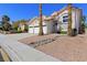 Charming two-story home with a three-car garage, desert landscaping, and well-maintained front yard at 191 Reed Ln, Henderson, NV 89074