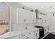 Well-lit kitchen featuring quartz countertops, stainless appliances, and herringbone backsplash at 191 Reed Ln, Henderson, NV 89074