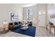 Spacious living room with high ceilings, large windows for natural light, and a cozy seating area at 191 Reed Ln, Henderson, NV 89074