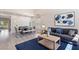 Inviting living and dining area with modern decor, high ceilings, and an open layout perfect for gatherings at 191 Reed Ln, Henderson, NV 89074