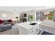 Open-concept living space with seamless flow between living and kitchen areas at 191 Reed Ln, Henderson, NV 89074