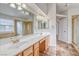 Bathroom with a wide double sink vanity, granite countertop, tile floors, separate shower, and arched doorways at 1933 Coralino Dr, Henderson, NV 89074