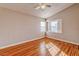 Empty bedroom with wood floors, windows, and a ceiling fan at 1933 Coralino Dr, Henderson, NV 89074