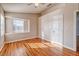 Bedroom with wood floors, neutral walls, windows and trim plus ceiling fan at 1933 Coralino Dr, Henderson, NV 89074