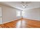 Spacious bedroom featuring wood floors, natural light, and neutral colored walls at 1933 Coralino Dr, Henderson, NV 89074