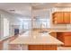 Bright kitchen featuring stone countertops and a stainless steel sink at 1933 Coralino Dr, Henderson, NV 89074