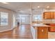 Bright kitchen adjacent to living area, showcasing light wood cabinets and modern countertops at 1933 Coralino Dr, Henderson, NV 89074