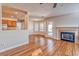 Living room with fireplace, access to the backyard, and view of the kitchen at 1933 Coralino Dr, Henderson, NV 89074