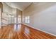 Inviting living room featuring hardwood floors, high ceilings, large windows, and an open, airy ambiance at 1933 Coralino Dr, Henderson, NV 89074