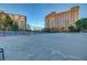 Well-maintained outdoor basketball court, lush landscaping and nearby condo buildings visible at 205 E Harmon Ave # 306, Las Vegas, NV 89169