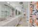 A bright bathroom with many sinks and vanity mirrors at 205 E Harmon Ave # 306, Las Vegas, NV 89169