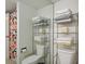 Bathroom featuring decorative storage and colorful shower curtain at 205 E Harmon Ave # 306, Las Vegas, NV 89169