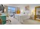 Bright bedroom featuring a large window, TV, and stylish decor at 205 E Harmon Ave # 306, Las Vegas, NV 89169