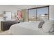 Bedroom with nice furnishings and a view of the city at 205 E Harmon Ave # 306, Las Vegas, NV 89169