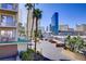 View from balcony featuring palm trees and city skyline, highlighting urban living at 205 E Harmon Ave # 306, Las Vegas, NV 89169