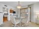 Dining area with a glass table, comfortable seating and natural light from the sliding glass door at 205 E Harmon Ave # 306, Las Vegas, NV 89169