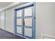 Condominium hallway features an ornate door with decorative, raised floral squares at 205 E Harmon Ave # 306, Las Vegas, NV 89169