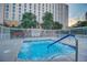 Inviting hot tub with railings and nearby bench offers a relaxing outdoor space at 205 E Harmon Ave # 306, Las Vegas, NV 89169