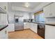 Spacious kitchen with tiled floors, stainless steel appliances, and ample cabinet space at 205 E Harmon Ave # 306, Las Vegas, NV 89169