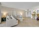 Bright living room features bar, comfortable seating and tiled floors at 205 E Harmon Ave # 306, Las Vegas, NV 89169