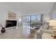 Bright living room with city views, comfortable seating and neutral color palette at 205 E Harmon Ave # 306, Las Vegas, NV 89169