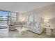 Inviting living room with comfortable seating and floor to ceiling windows at 205 E Harmon Ave # 306, Las Vegas, NV 89169