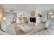 Bright, open-concept living room with a marble coffee table, modern furnishings and a breakfast bar area at 205 E Harmon Ave # 306, Las Vegas, NV 89169