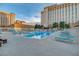 Large swimming pool with lounge chairs offers a relaxing outdoor space for residents at 205 E Harmon Ave # 306, Las Vegas, NV 89169