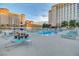 Inviting pool with tables and chairs perfect for lounging and socializing by the water at 205 E Harmon Ave # 306, Las Vegas, NV 89169