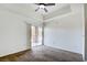 Bedroom featuring a ceiling fan and a sliding glass door to the balcony at 23 E Agate Ave # 207, Las Vegas, NV 89123