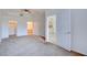 Bright main bedroom offering walk-in closet, ensuite bathroom, neutral paint, and carpet flooring at 23 E Agate Ave # 207, Las Vegas, NV 89123
