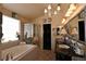 Elegantly designed bathroom with a jetted tub, separate shower, and dual vanities at 2305 Flower Spring St, Las Vegas, NV 89134