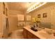 Bathroom features a vanity, double sink, and a shower over the tub at 2305 Flower Spring St, Las Vegas, NV 89134