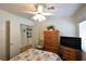 Comfortable bedroom with a spacious closet, hardwood flooring, and neutral colored walls at 2305 Flower Spring St, Las Vegas, NV 89134