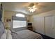 Bedroom showcases a bed with blue and white striped bedding and large closet at 2305 Flower Spring St, Las Vegas, NV 89134