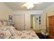 Bright bedroom offering closet space, light colored walls, and a decorative bedspread at 2305 Flower Spring St, Las Vegas, NV 89134
