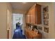 Hallway features natural light and a display cabinet with framed photos at 2305 Flower Spring St, Las Vegas, NV 89134
