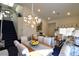 Spacious open-concept living room and dining area featuring high ceilings and an elegant staircase at 2305 Flower Spring St, Las Vegas, NV 89134