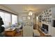 Comfortable living room with a fireplace, ample seating, and neutral colors at 2305 Flower Spring St, Las Vegas, NV 89134