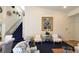 Comfortable living area with an elegant staircase and decor at 2305 Flower Spring St, Las Vegas, NV 89134