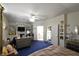 Spacious main bedroom featuring a fireplace, TV, dresser, and bed at 2305 Flower Spring St, Las Vegas, NV 89134