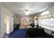 A well-lit main bedroom showcasing ample space and an elegant design at 2305 Flower Spring St, Las Vegas, NV 89134
