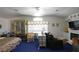 A spacious main bedroom features vaulted ceilings, a fireplace, and a seating area for relaxing at 2305 Flower Spring St, Las Vegas, NV 89134