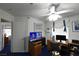 Office space featuring a desk, TV, and comfortable seating area at 2305 Flower Spring St, Las Vegas, NV 89134