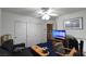 Office space featuring a desk, TV, and comfortable seating area at 2305 Flower Spring St, Las Vegas, NV 89134