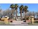 Park entrance with desert landscaping, palm trees, and outdoor seating with shade at 2305 Flower Spring St, Las Vegas, NV 89134