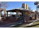 Park pavilion with picnic tables and access ramp with desert landscape at 2305 Flower Spring St, Las Vegas, NV 89134